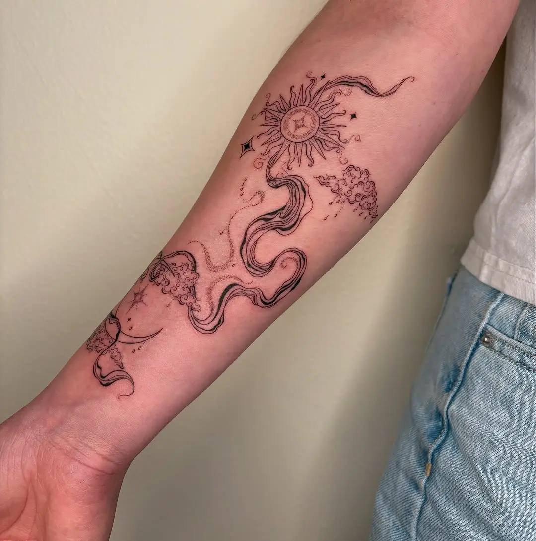 Elegant cloud and sun forearm tattoo design