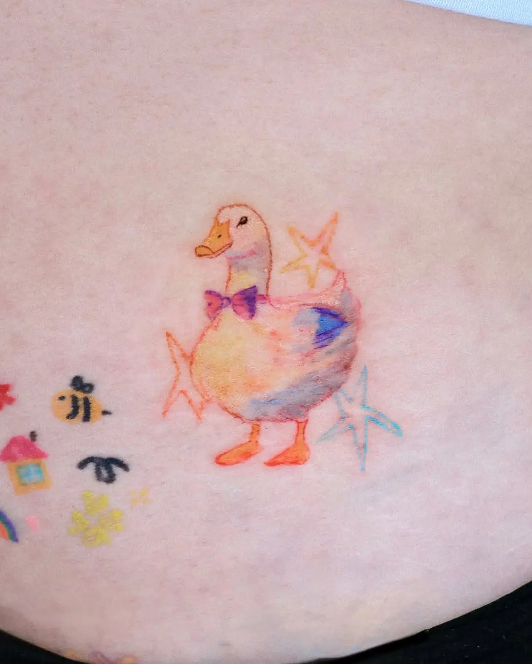 Cute colorful duck tattoo with whimsical vibes