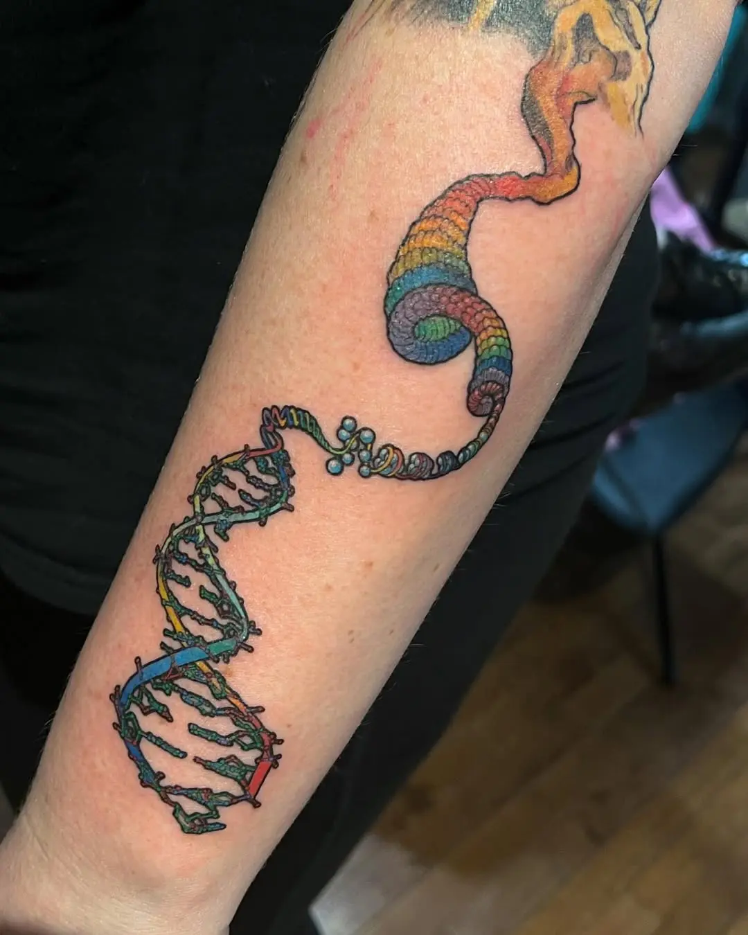 Vibrant DNA Tattoo with Rainbow Helix
