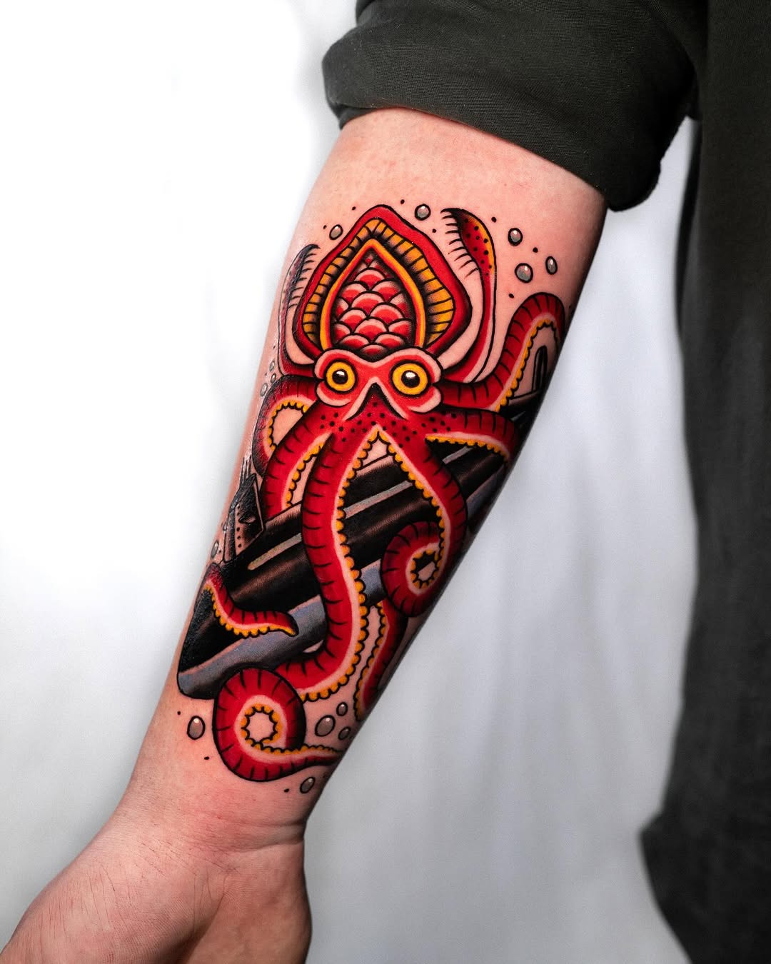 Vibrant octopus embracing a submarine tattoo