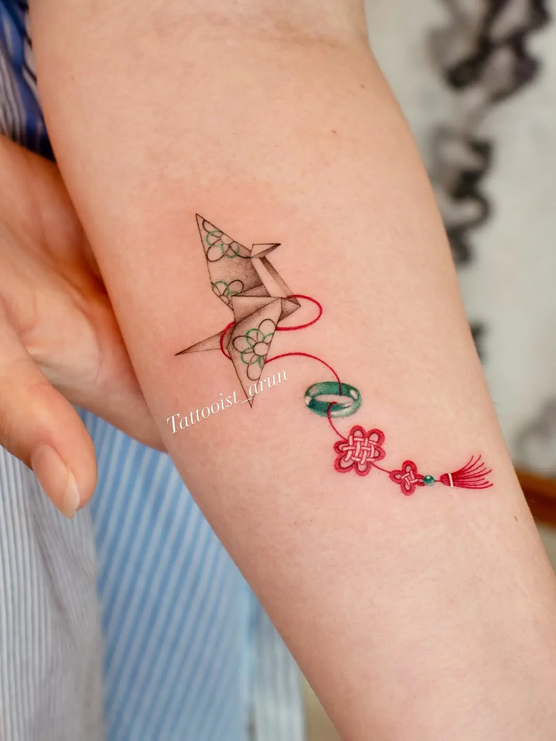 Intricate Origami Tattoo with Floral Accents