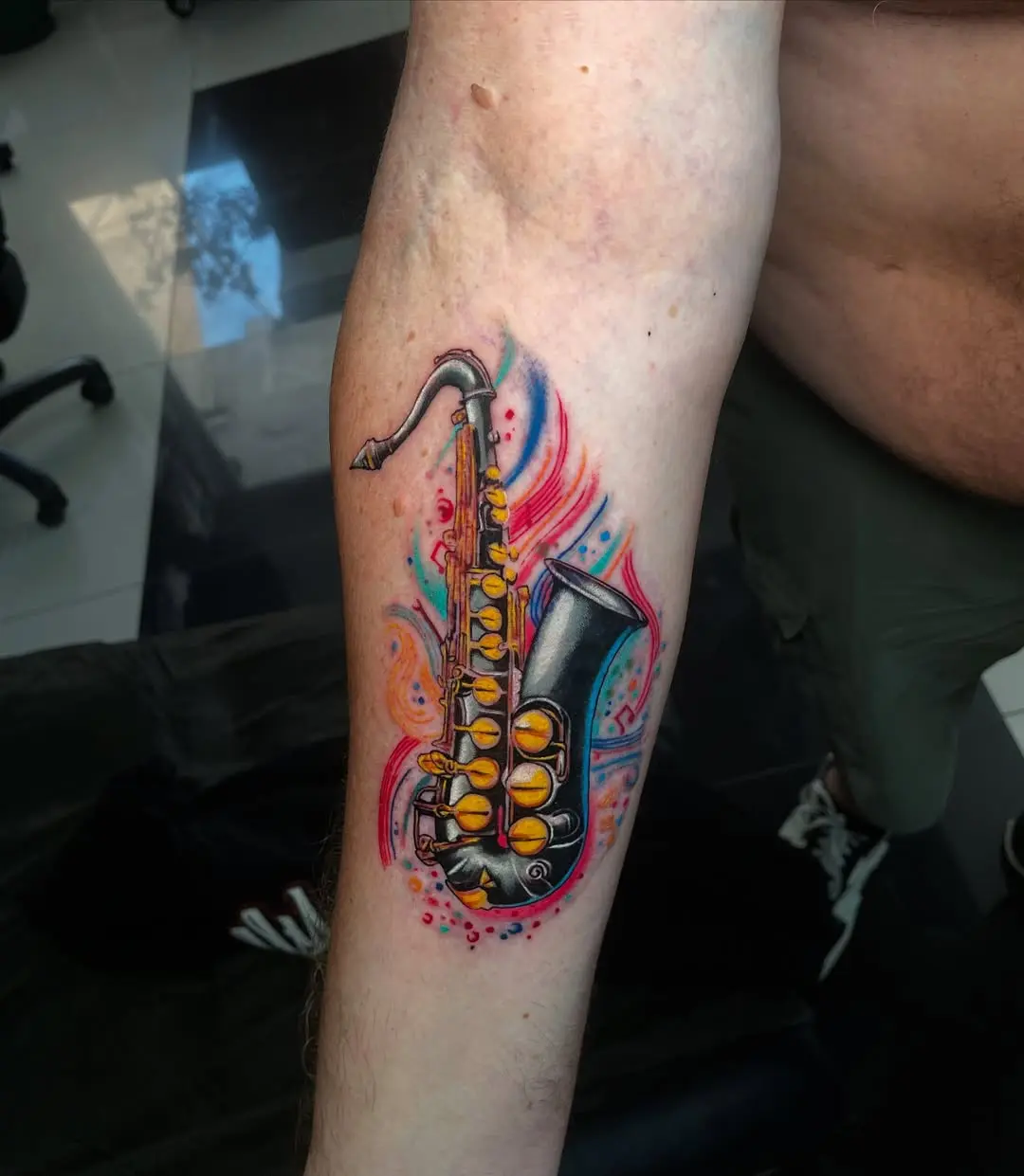 Colorful saxophone tattoo with vibrant details