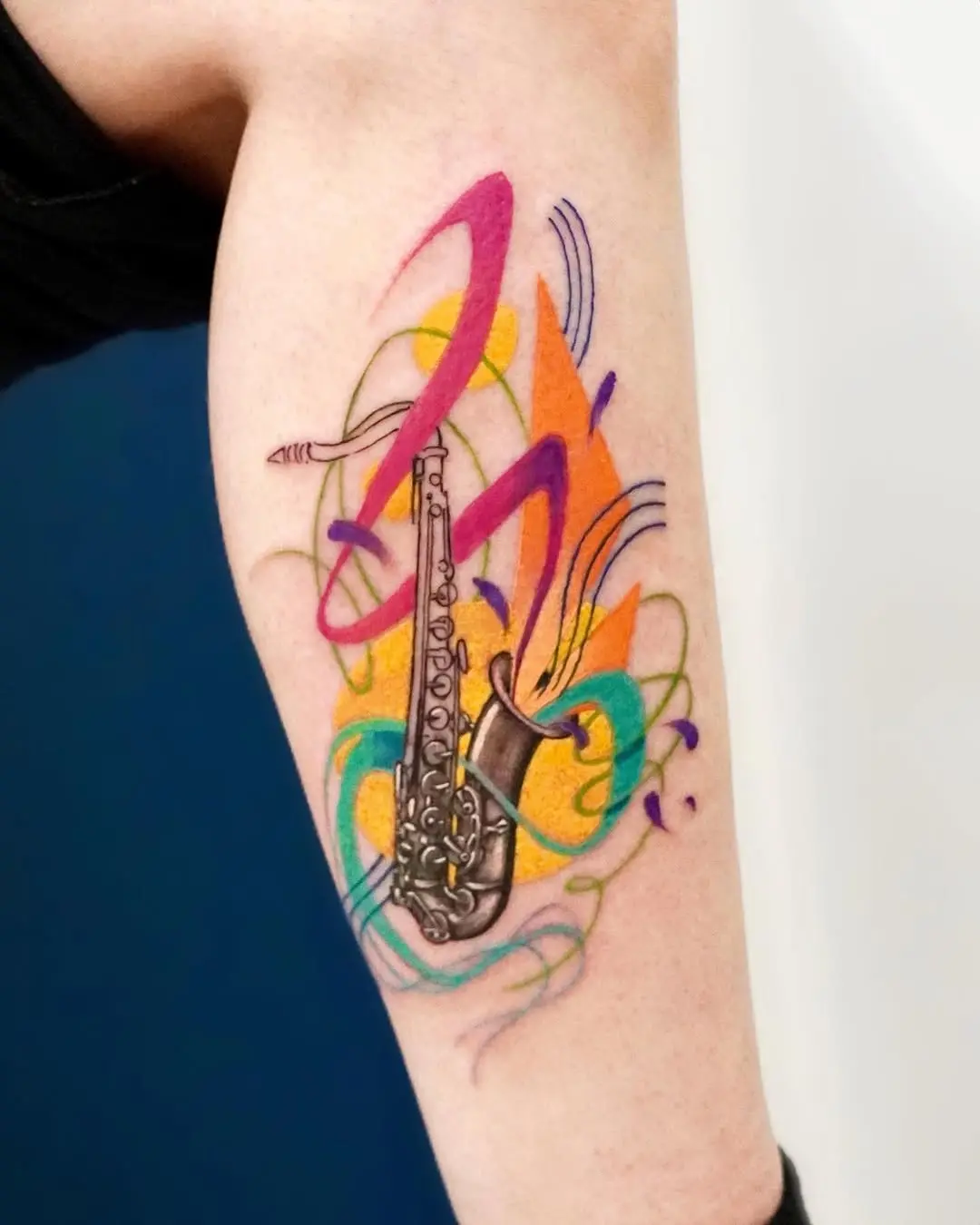 Vibrant saxophone tattoo with artistic flair