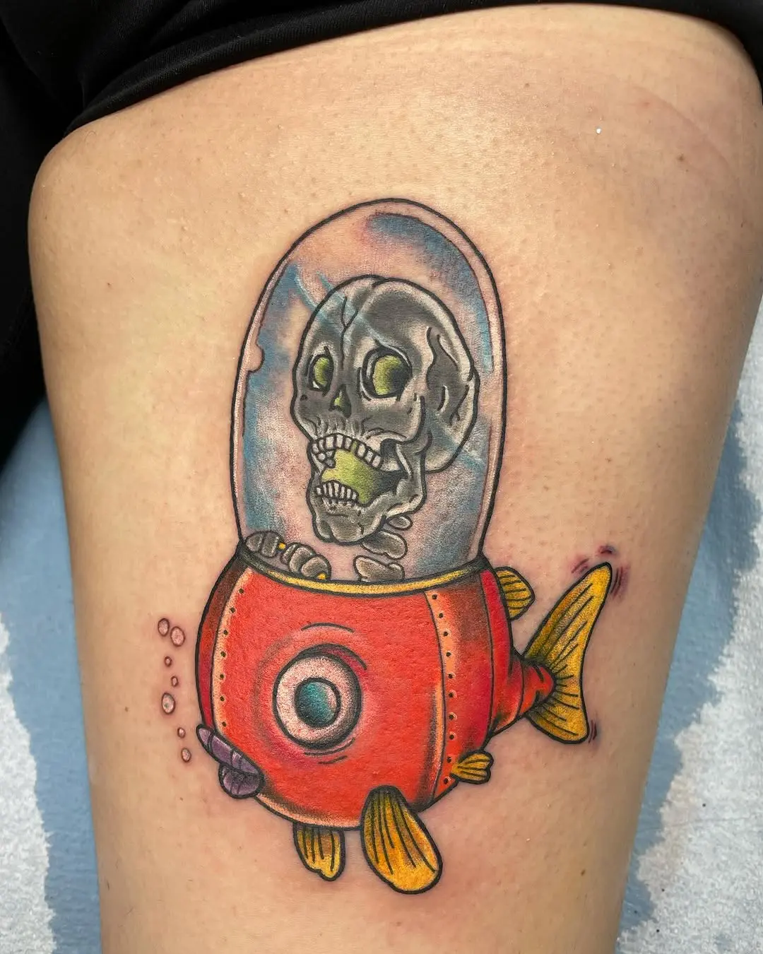 Whimsical submarine tattoo with skeleton pilot