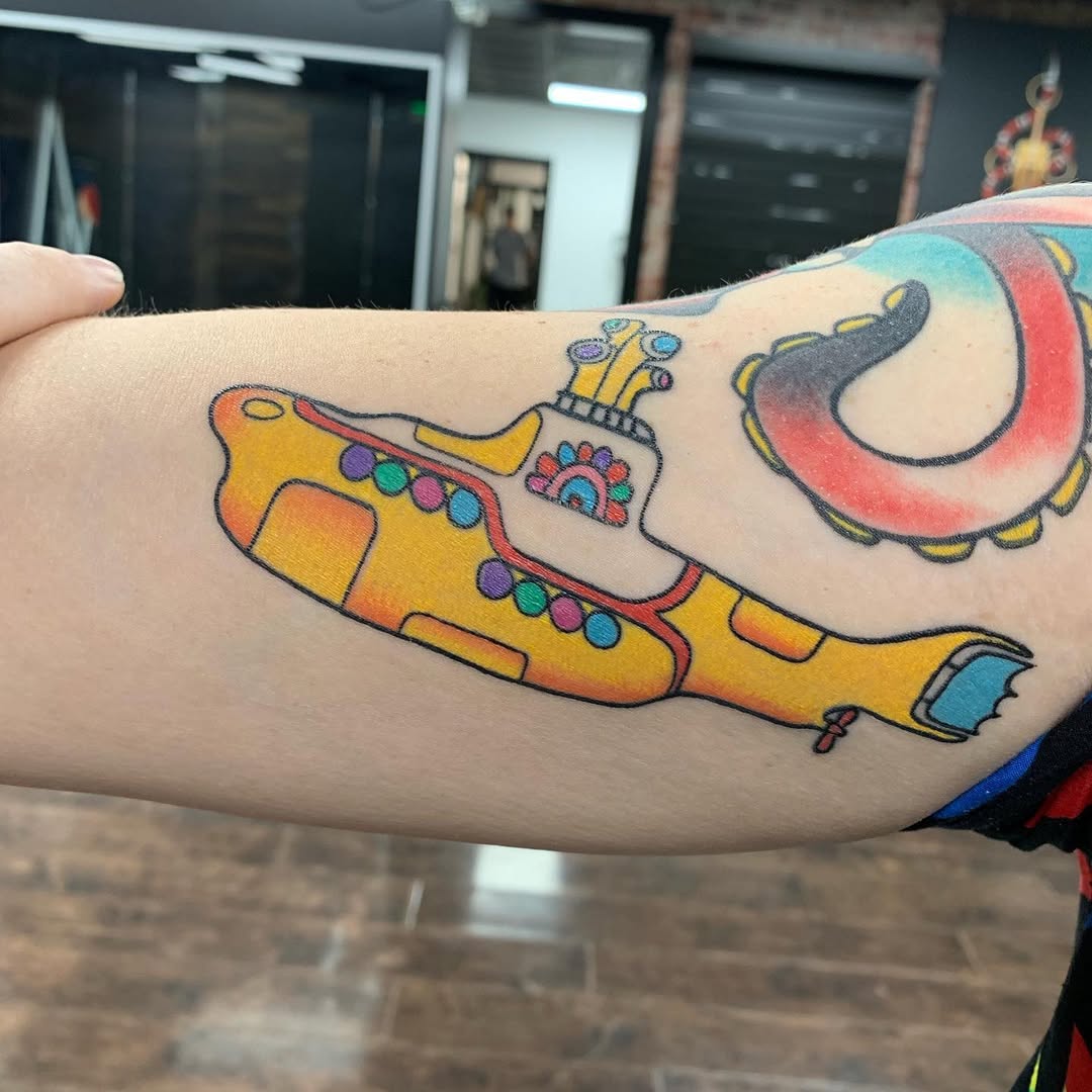 Whimsical submarine tattoo with vivid colors