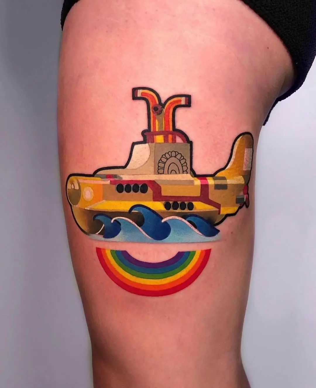 Vibrant submarine tattoo with rainbow waves