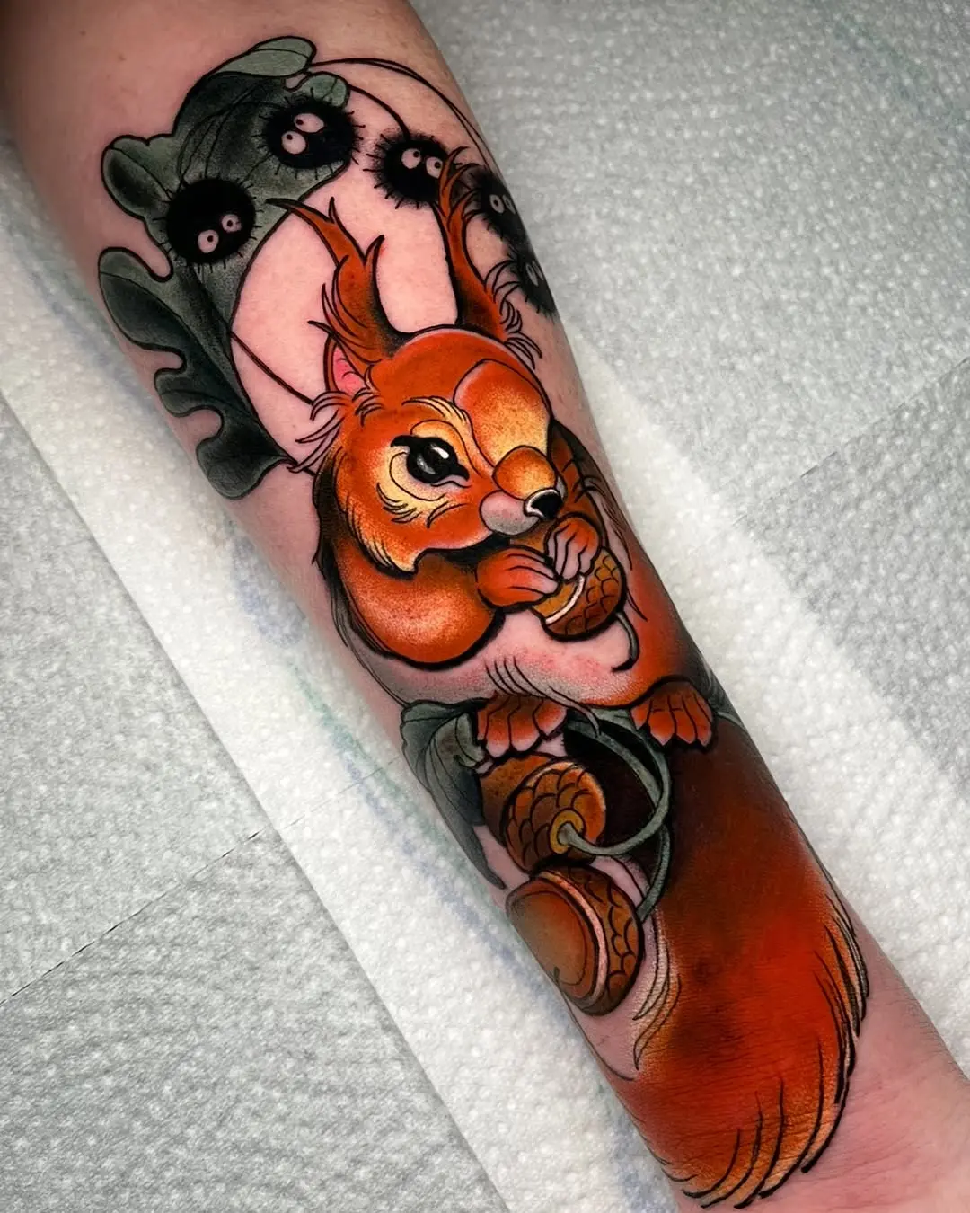 Whimsical squirrel tattoo with vibrant colors