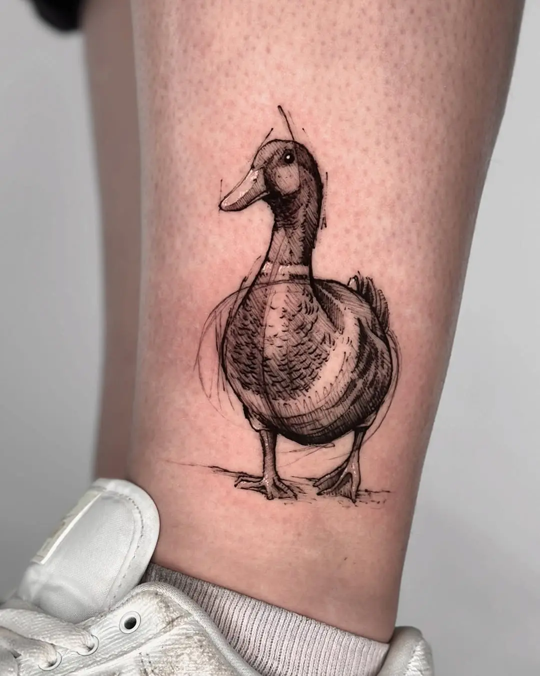 Artistic duck tattoo in playful style