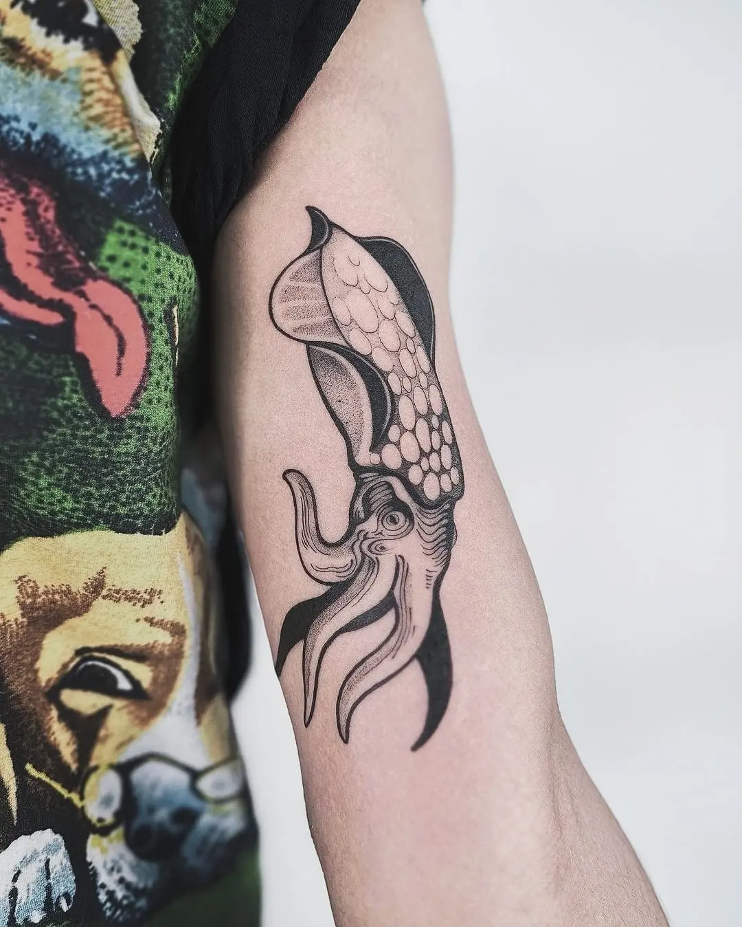 Stylish squid tattoo on the forearm