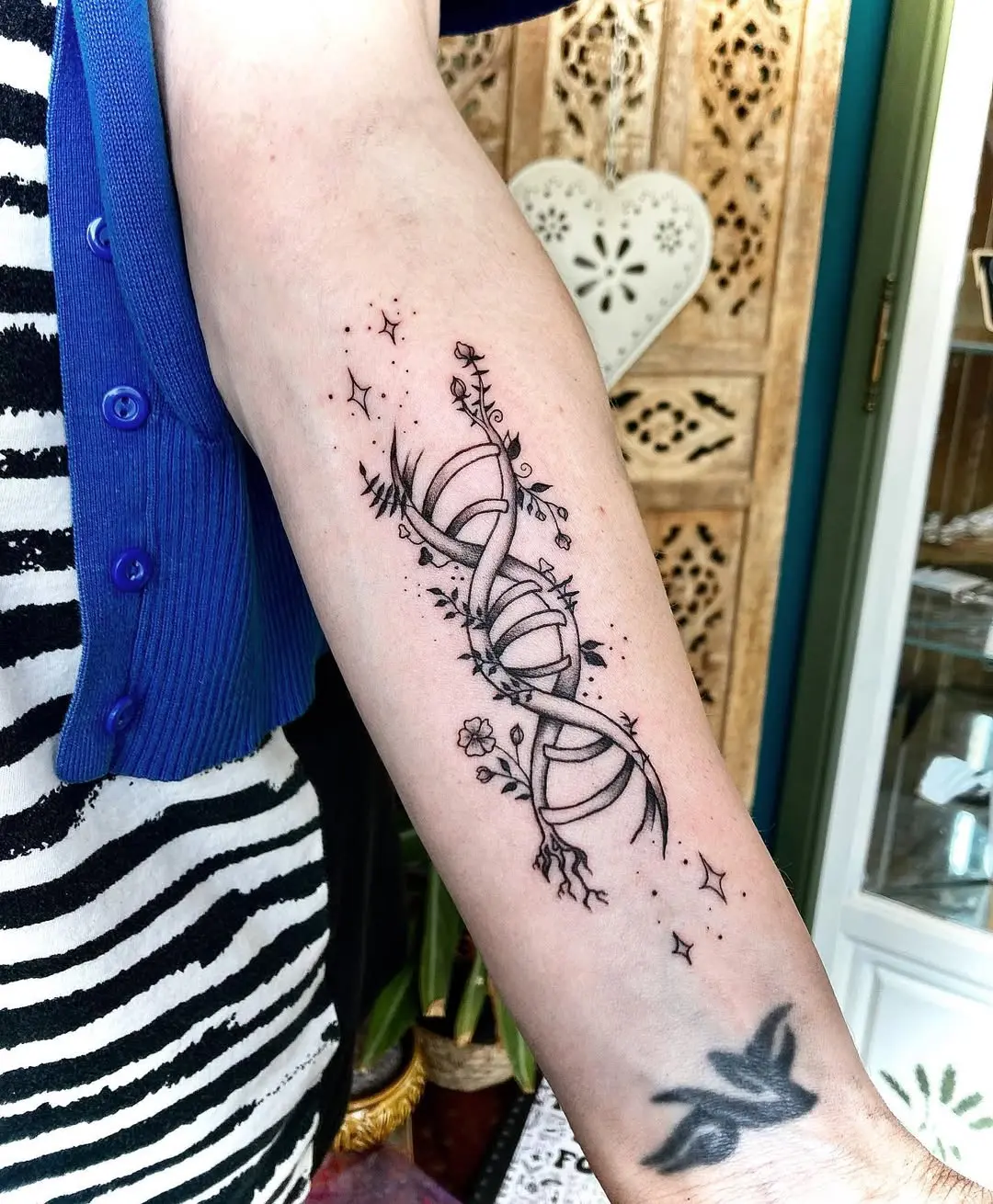 Intricate DNA Tattoo with Floral Detailing