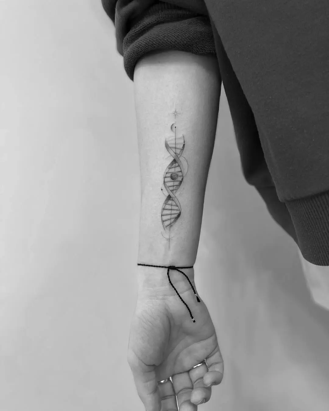 Elegant black and white DNA design tattoo