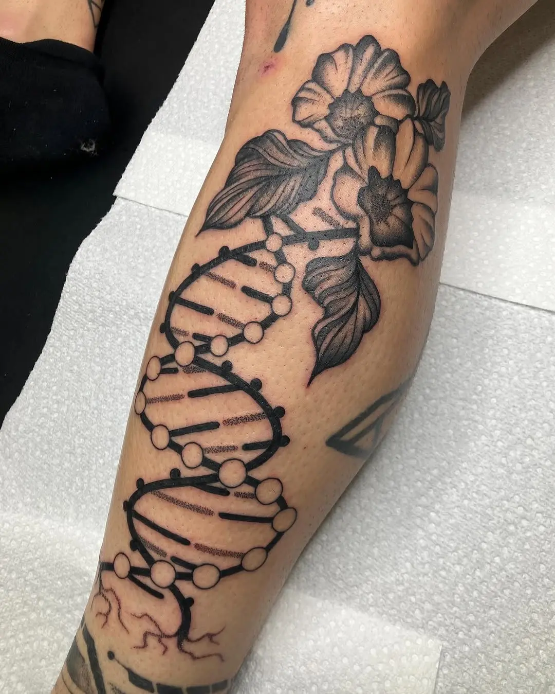 Elegant DNA Tattoo with Floral Accents