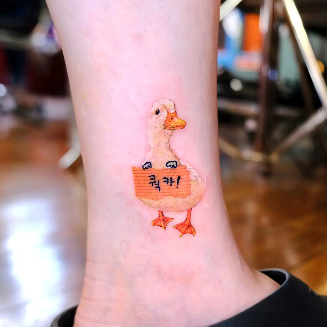 Bright and playful duck inked on the skin