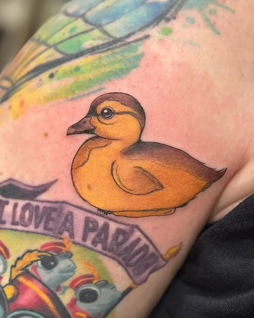 Charming yellow duck tattoo with artistic flair