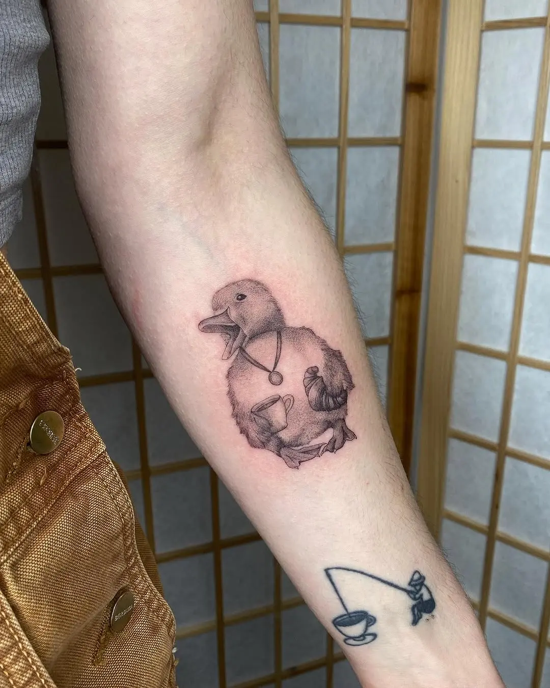 Charming duck tattoo with vintage vibes