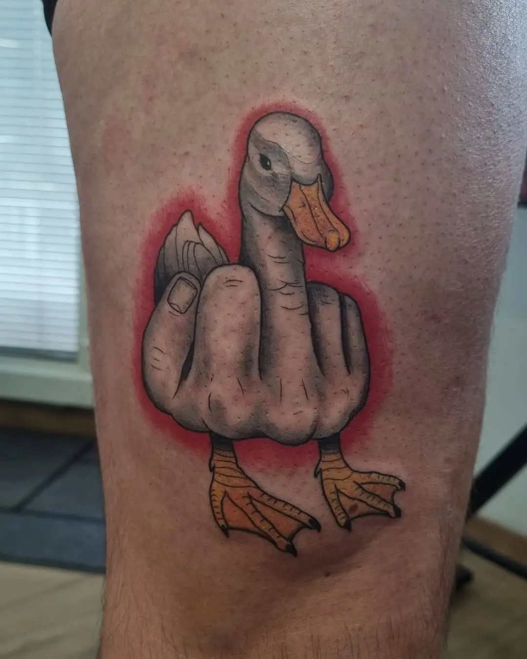 Whimsical duck tattoo with a unique twist