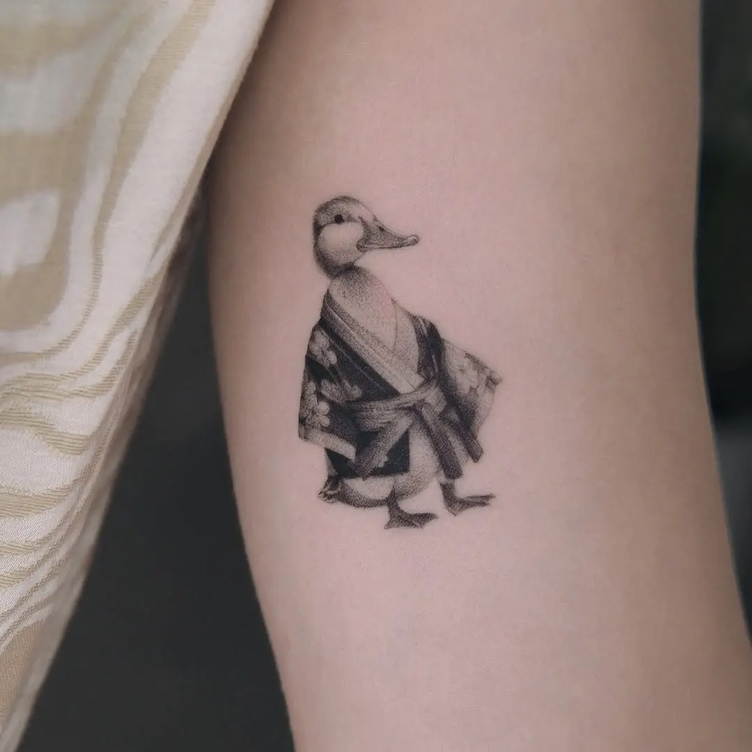Elegant duck tattoo in traditional attire