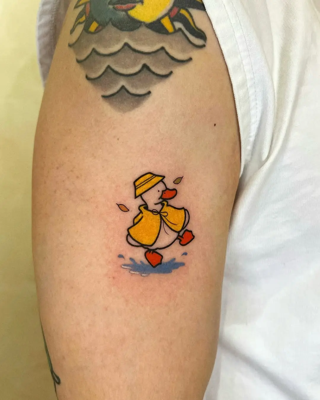 Playful duck tattoo in vibrant colors