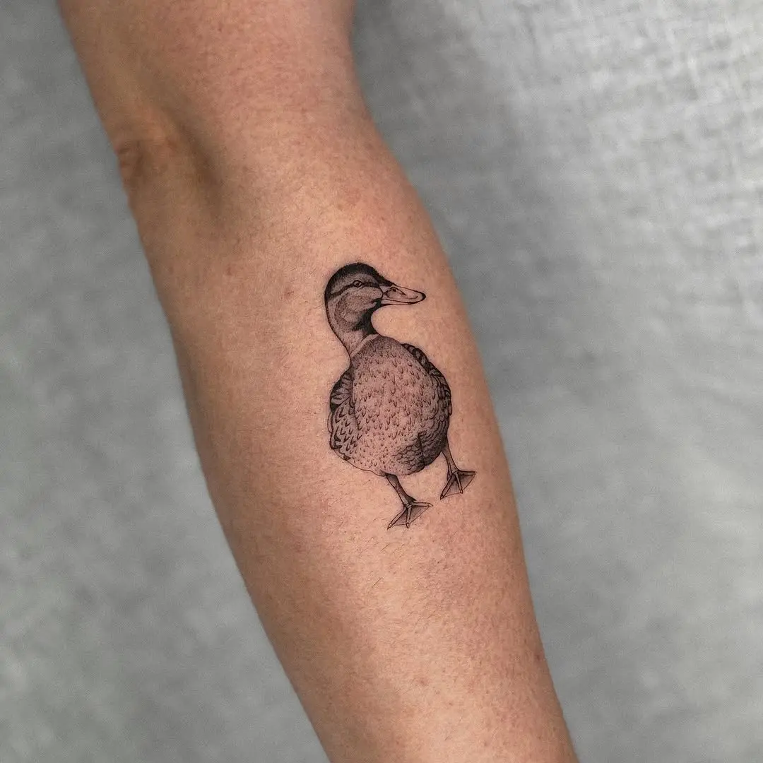 Charming duck tattoo on the forearm