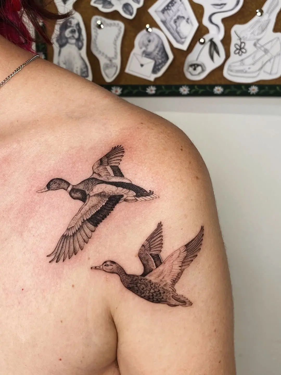 Elegant Duck Tattoos in Mid-Flight Display
