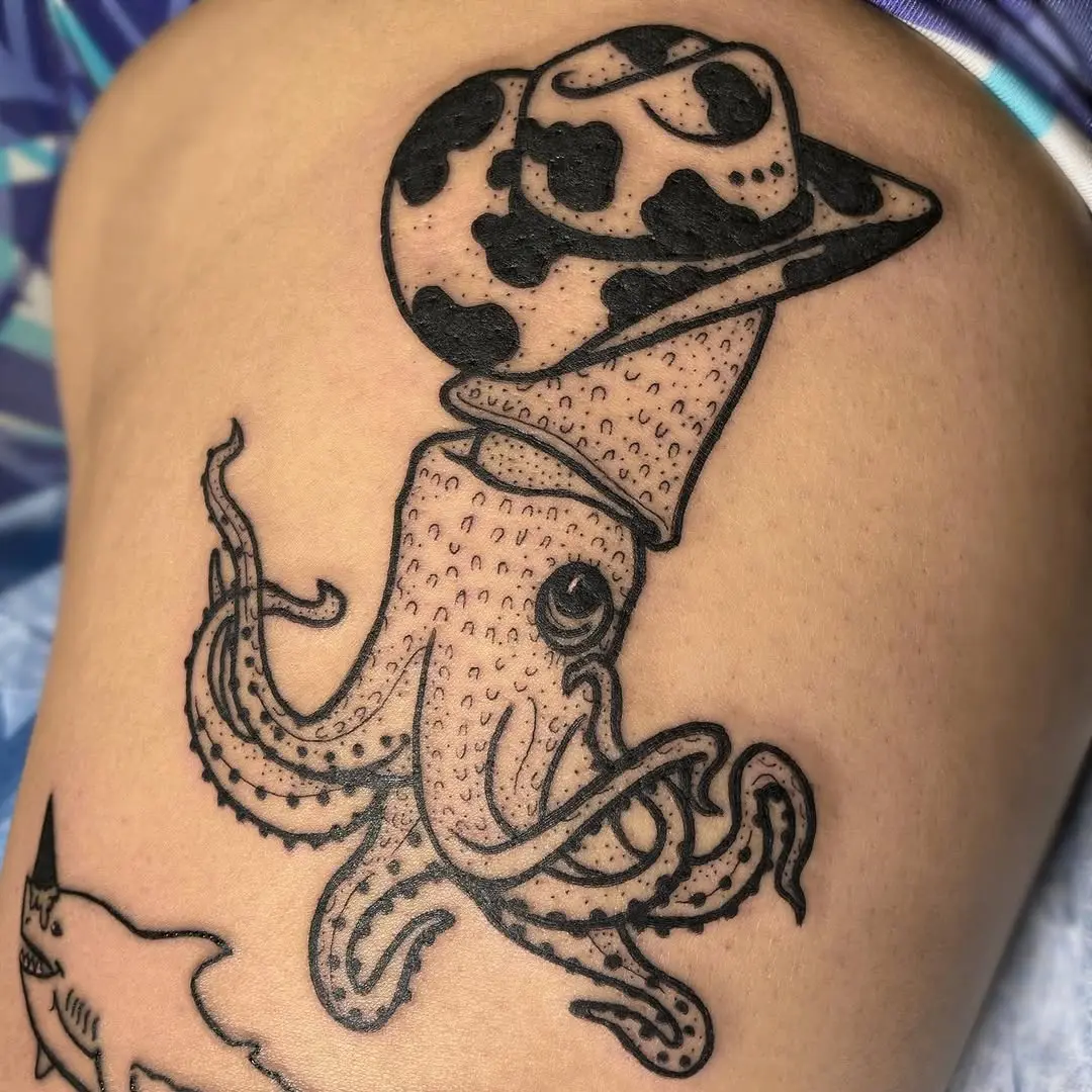 Unique squid tattoo with a cowboy hat