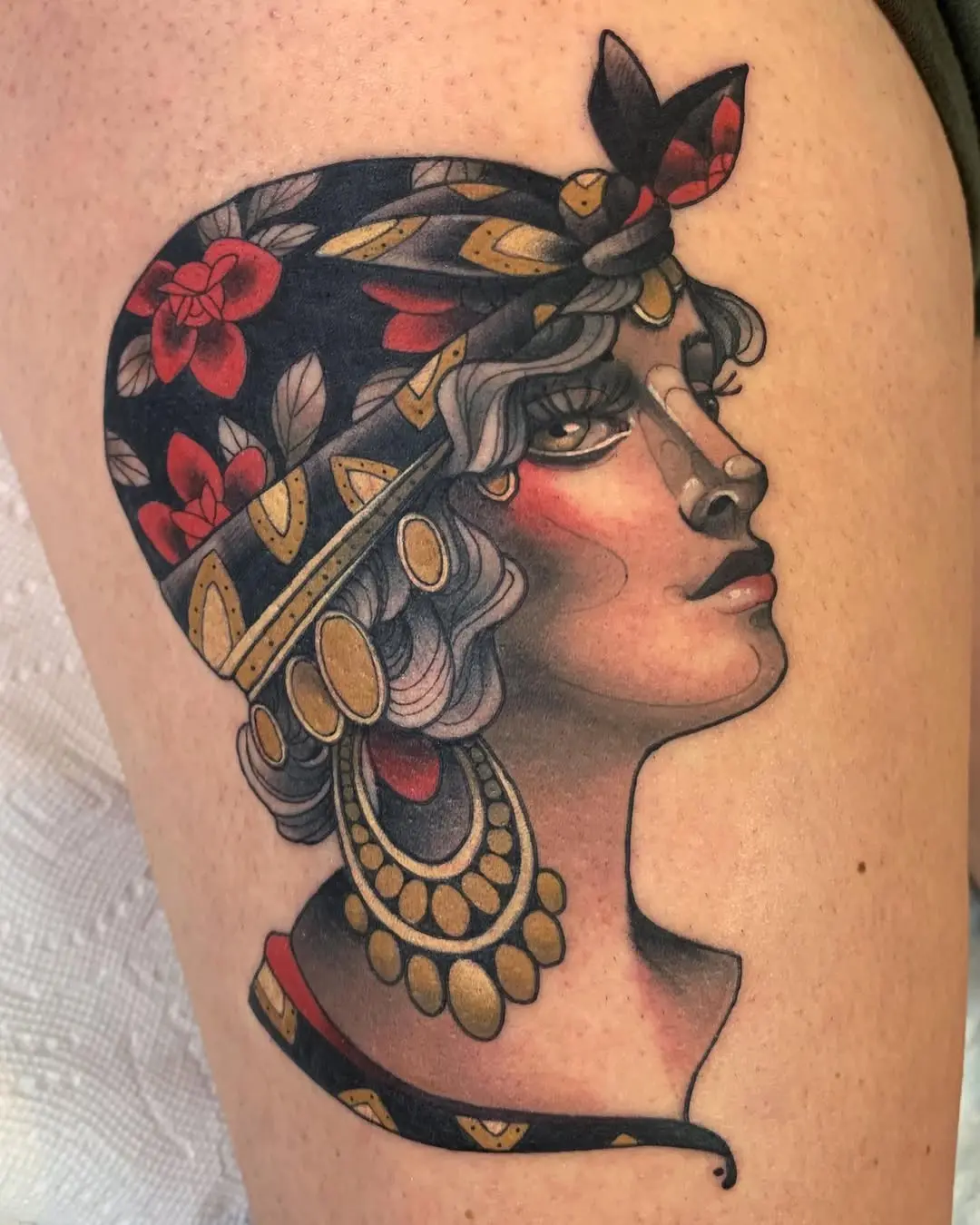 Intricately designed gypsy woman tattoo on skin