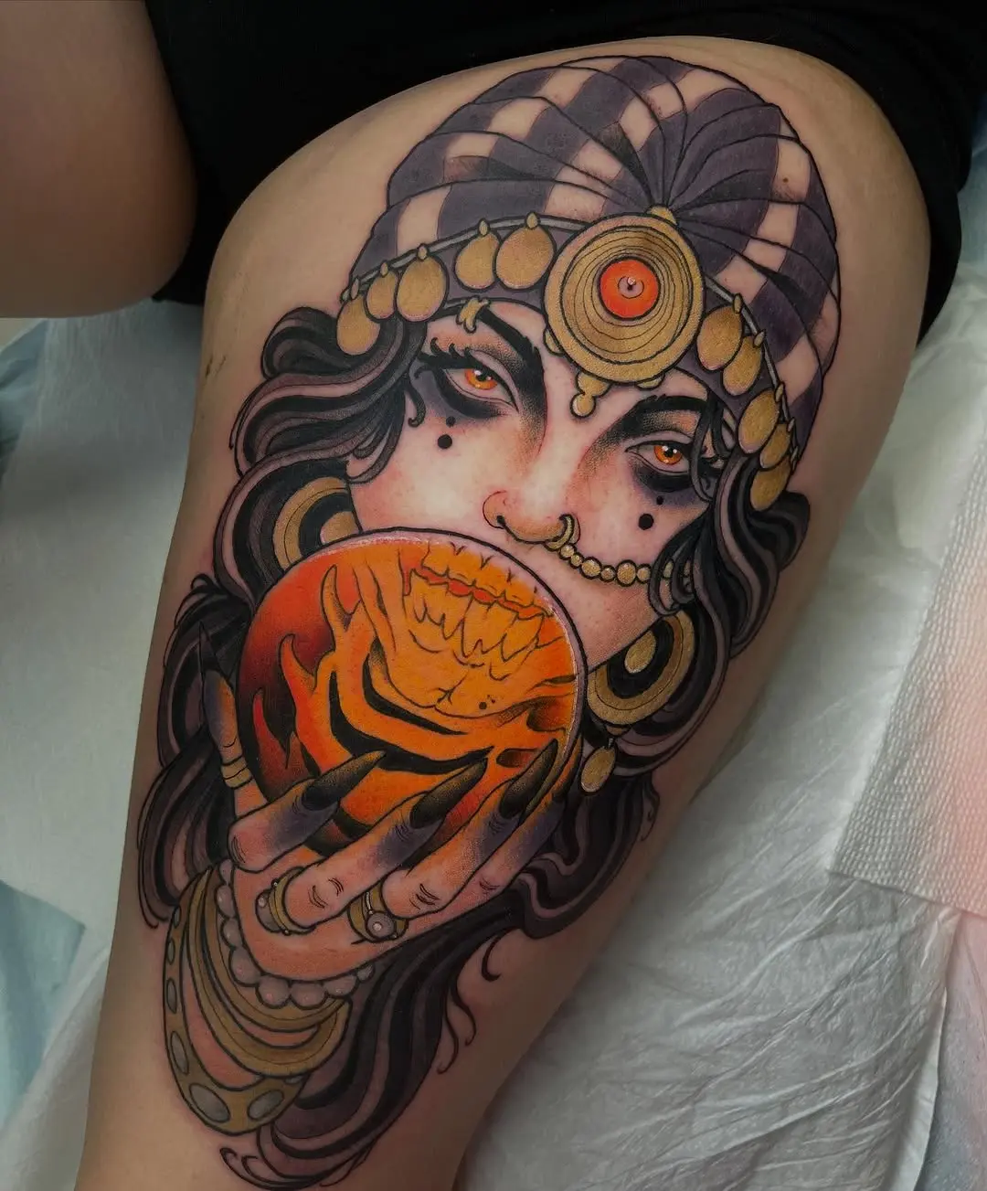 Mystical woman with orange sphere tattoo design