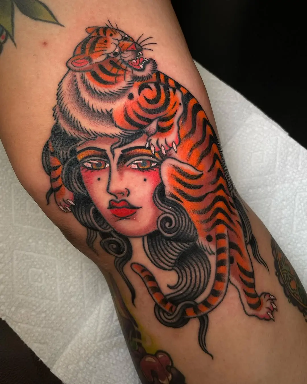 Bold Woman Tattoo with a Majestic Tiger