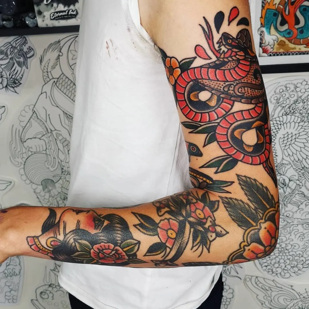 Vibrant Sleeve Tattoo Featuring Snake and Flowers