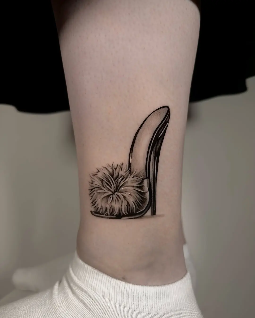 Elegant shoe tattoo with fluffy detail