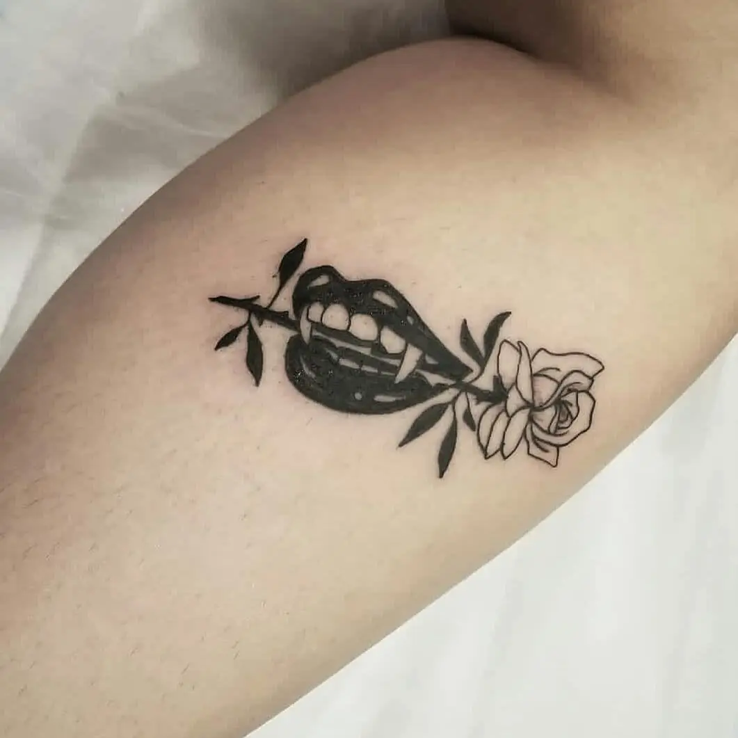 Bold lips with floral elegance in tattoo art