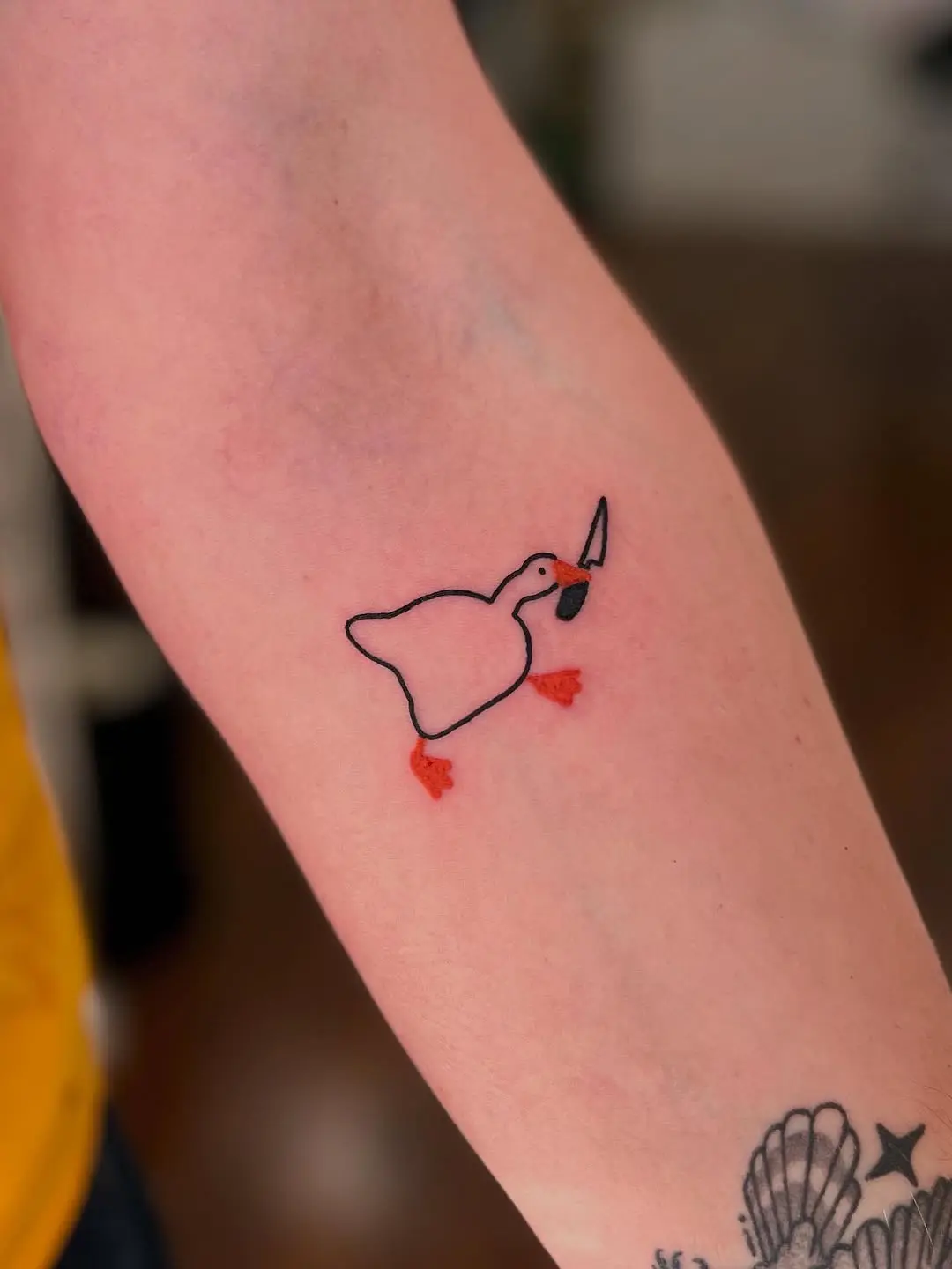 Charming minimalist duck tattoo design