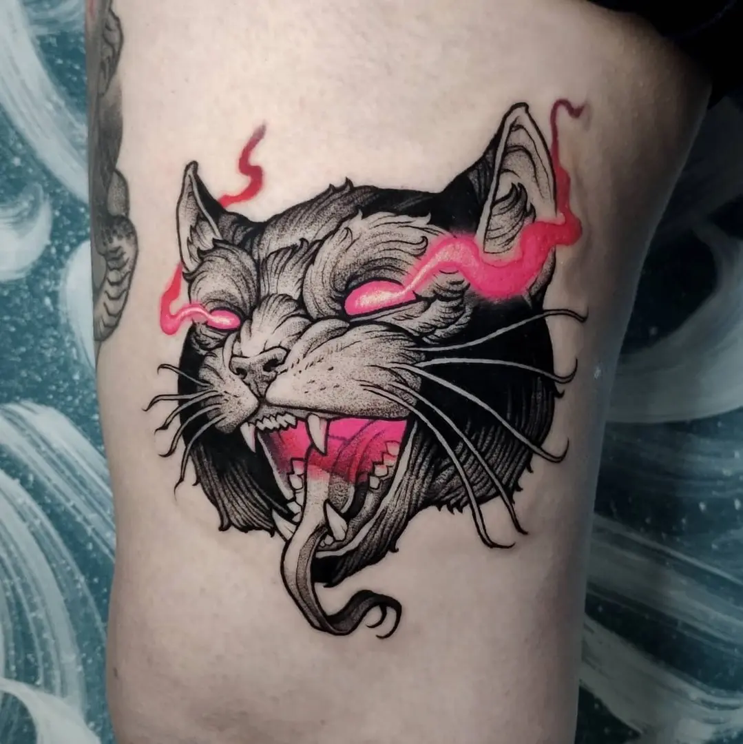 Vibrant neon cat tattoo with fierce expression