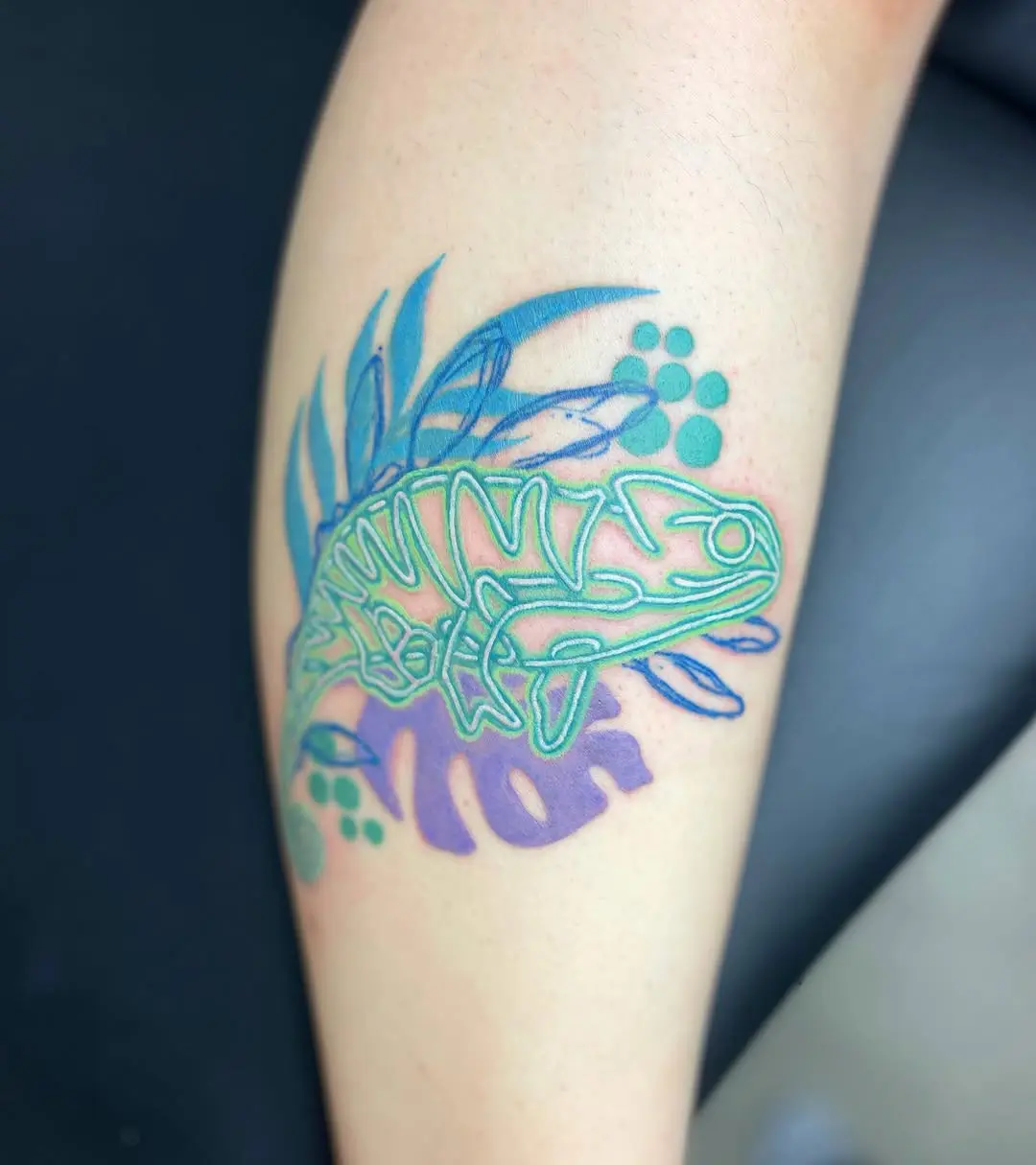 Colorful neon frog tattoo design on skin