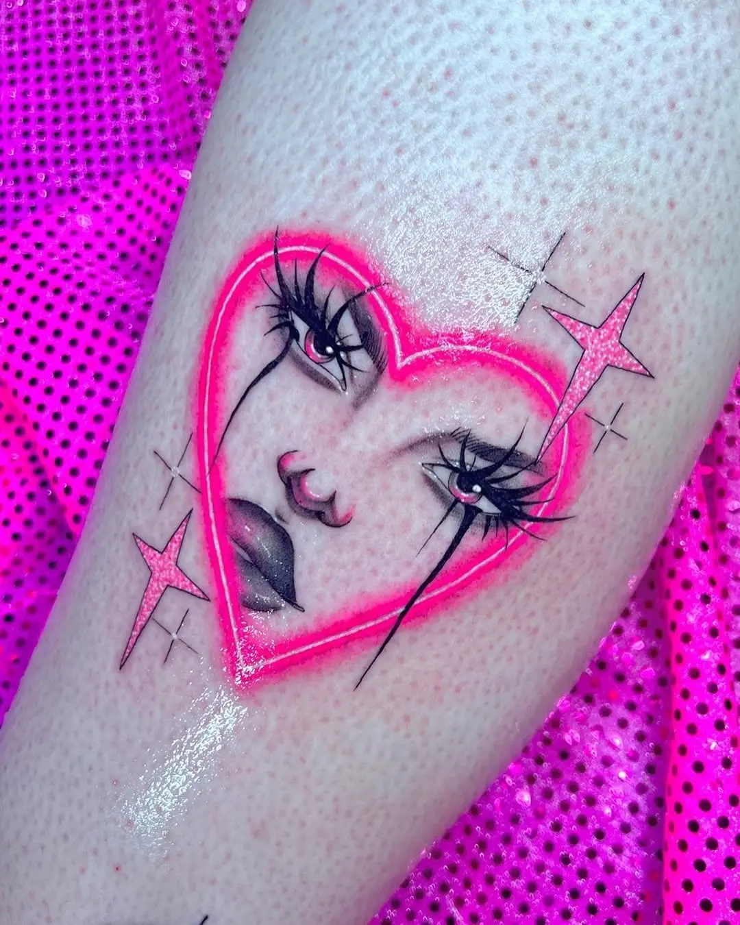 Vibrant neon heart tattoo with striking features