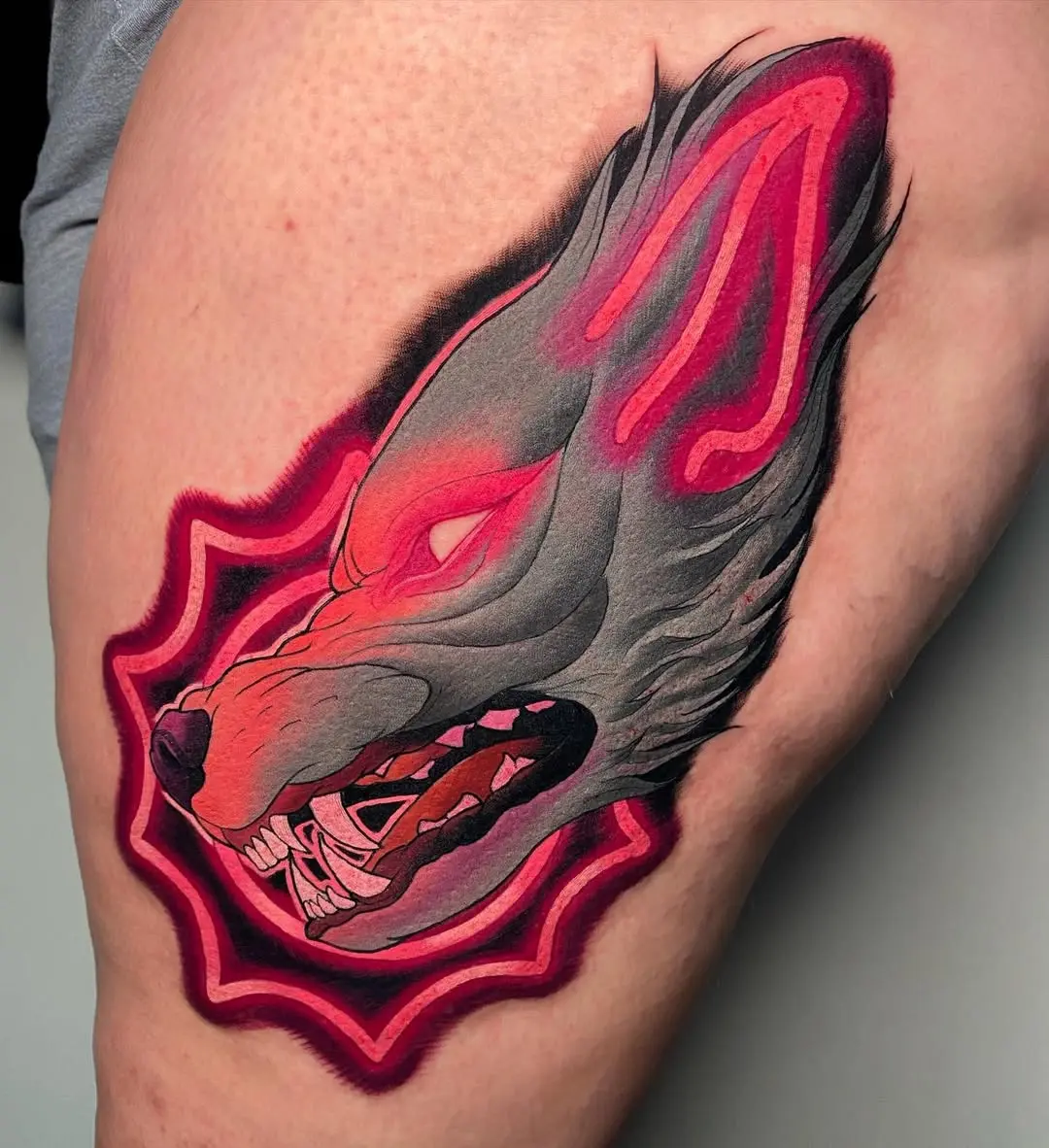 Striking neon wolf tattoo with vibrant colors