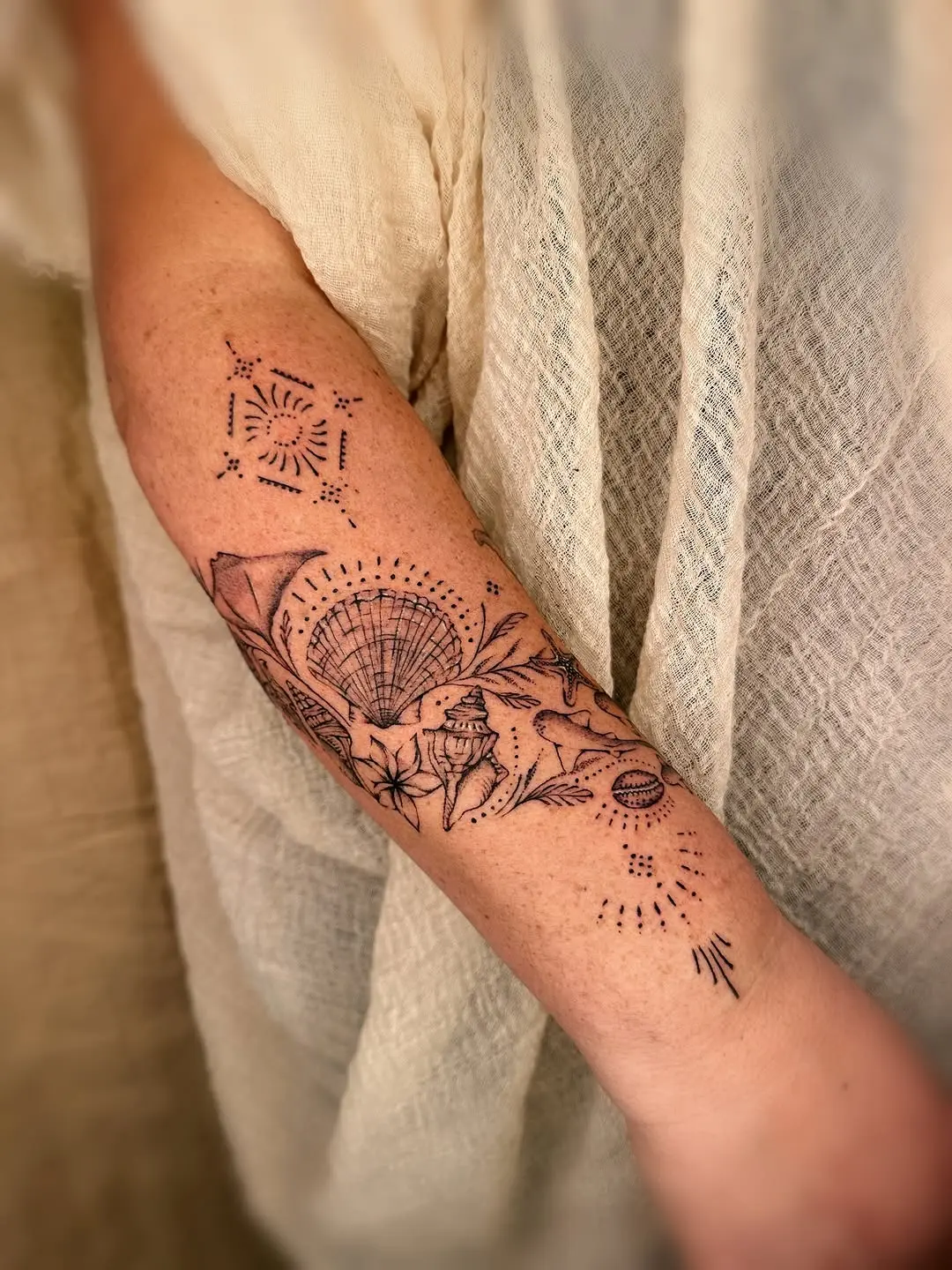 Intricate ocean-themed tattoo design with elements