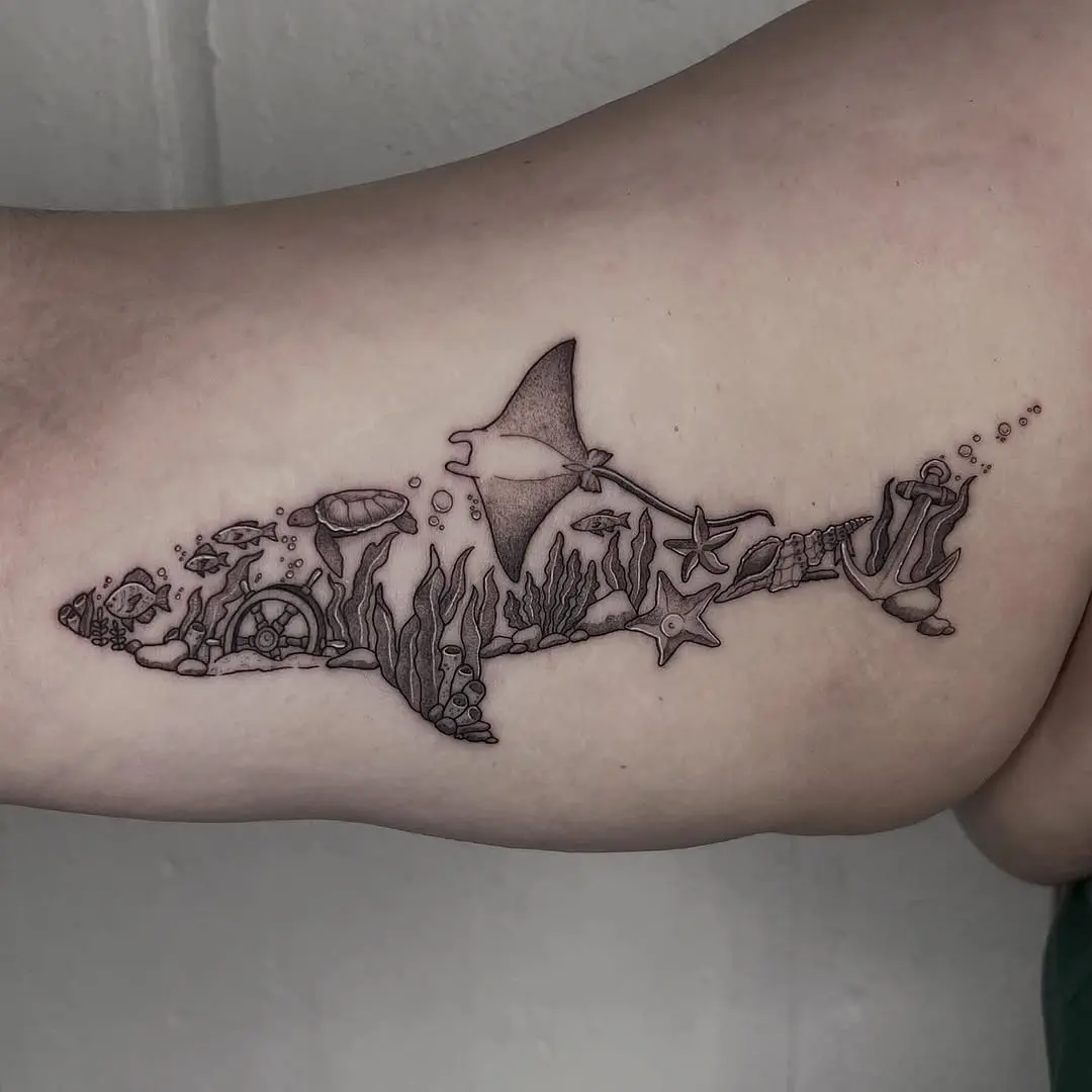 Intricate manta ray tattoo with ocean elements