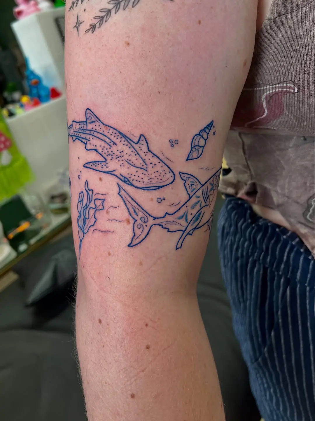 Whimsical ocean-themed shark tattoo design