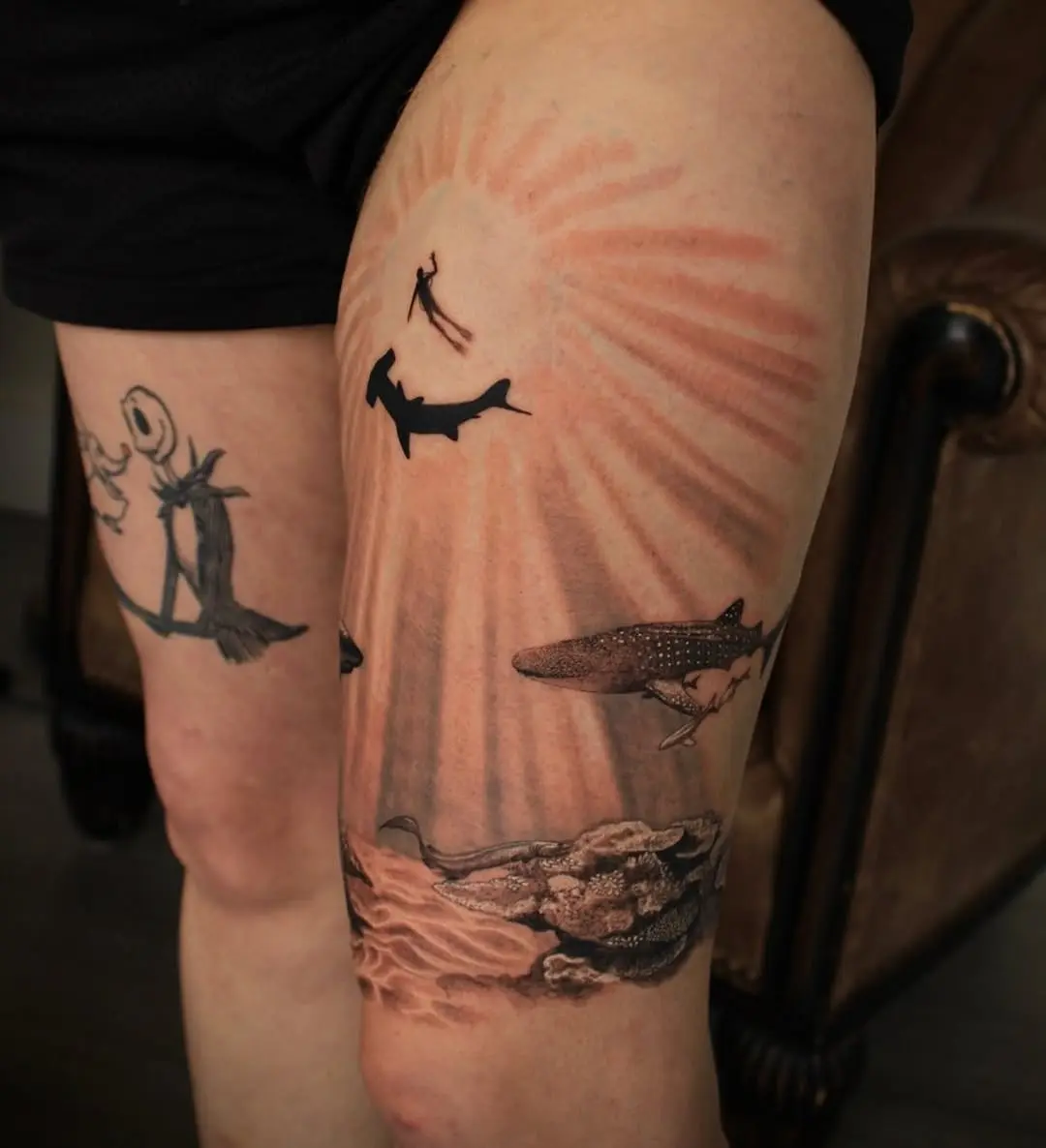 Stunning ocean-themed shark tattoos in sunset