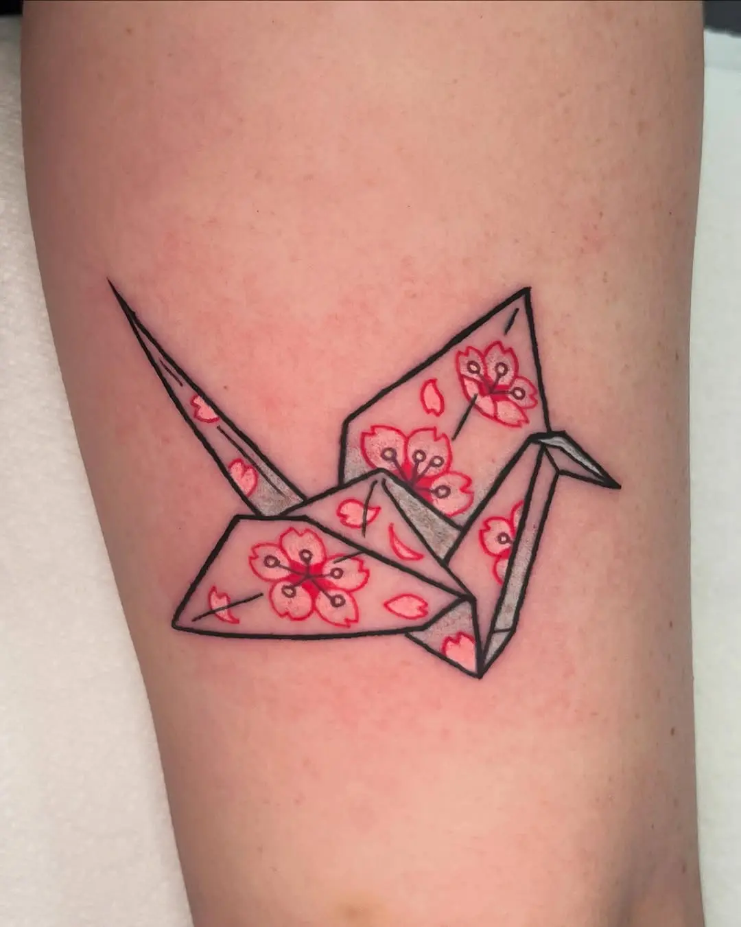 Elegant origami crane with floral accents