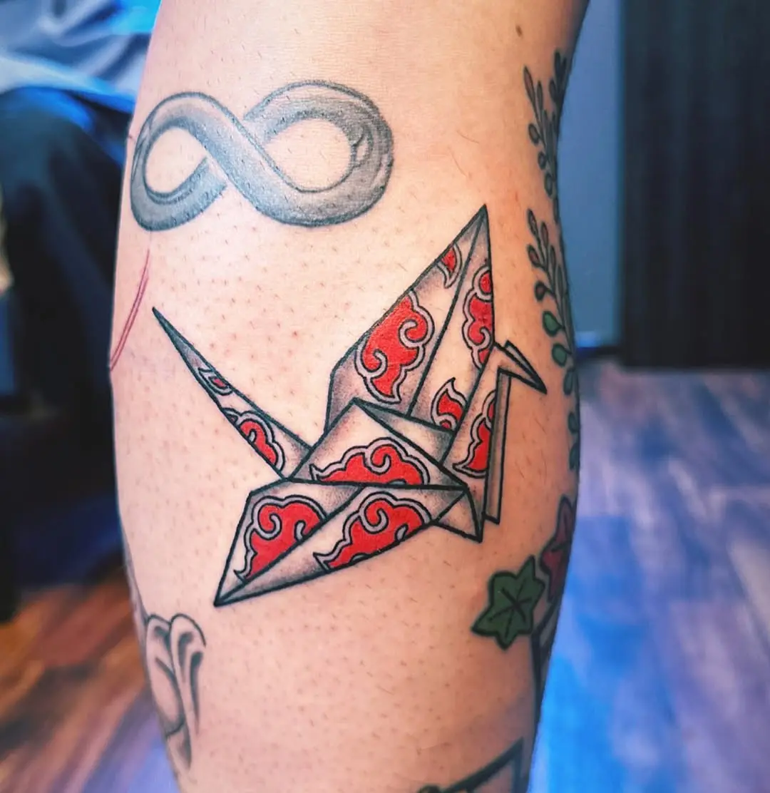 Bold Origami Crane Tattoo with Red Details