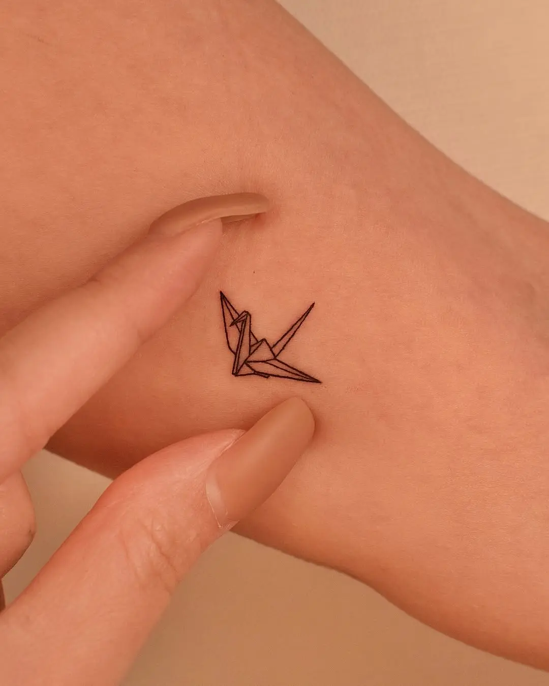 Elegant Minimalist Origami Crane Tattoo Design