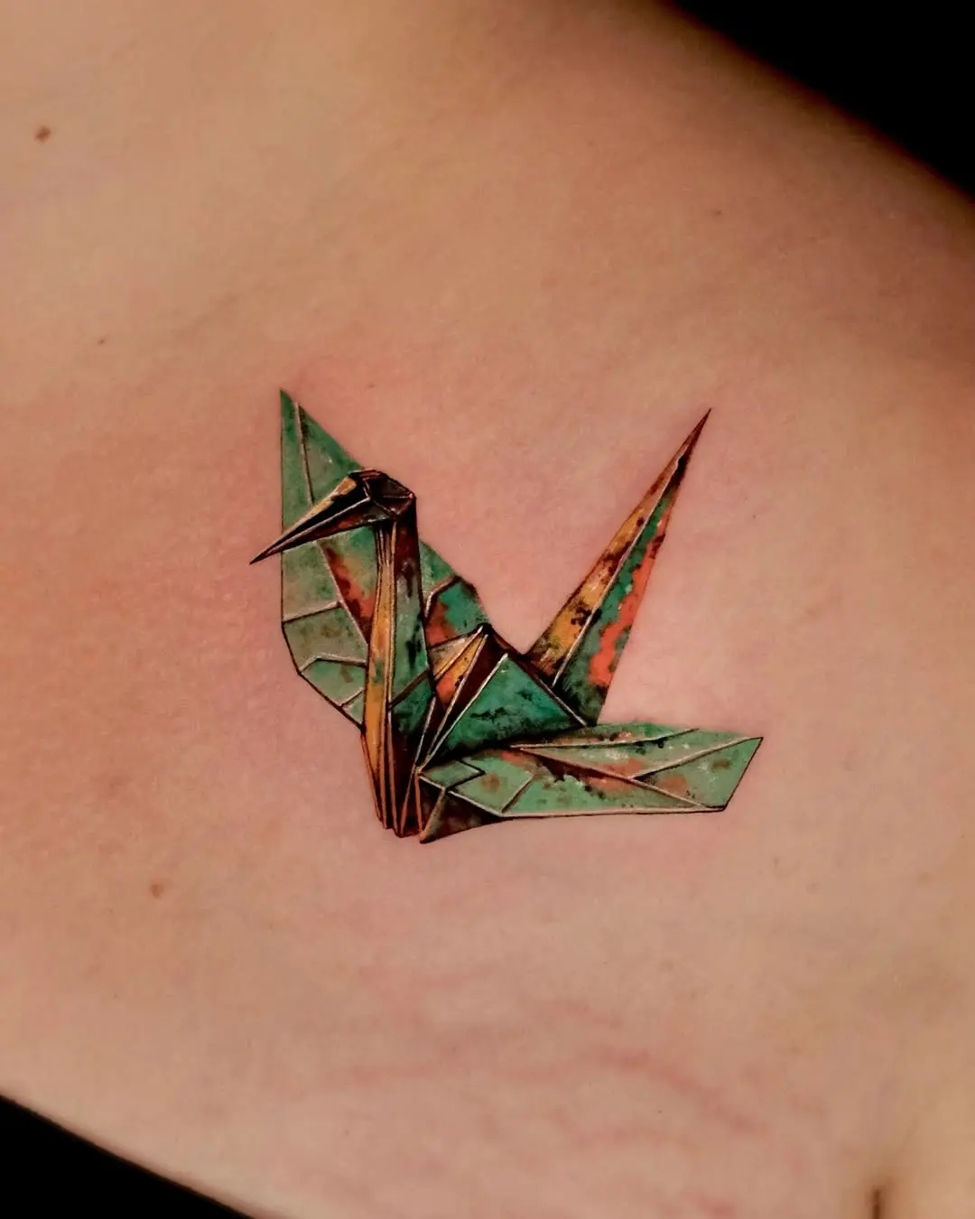 Stunning origami crane tattoo with vibrant colors