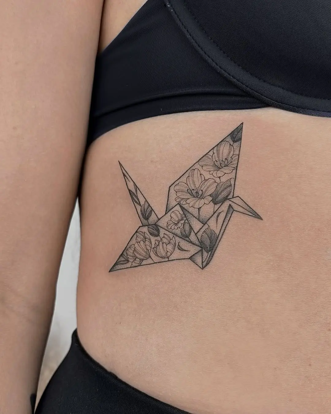 Stunning Origami Crane Tattoo with Floral Details