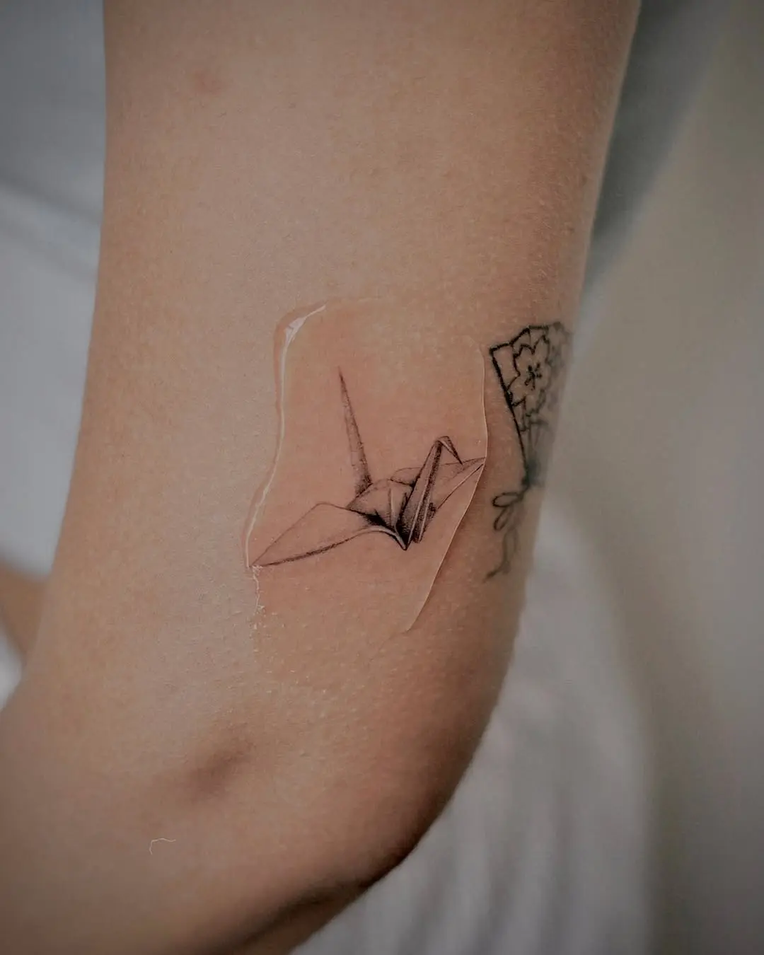 Elegant Origami Crane Tattoos on Skin