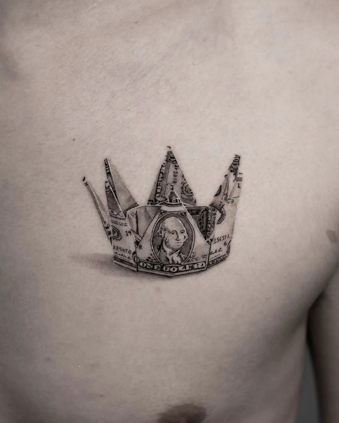Unique origami crown tattoo from a dollar bill