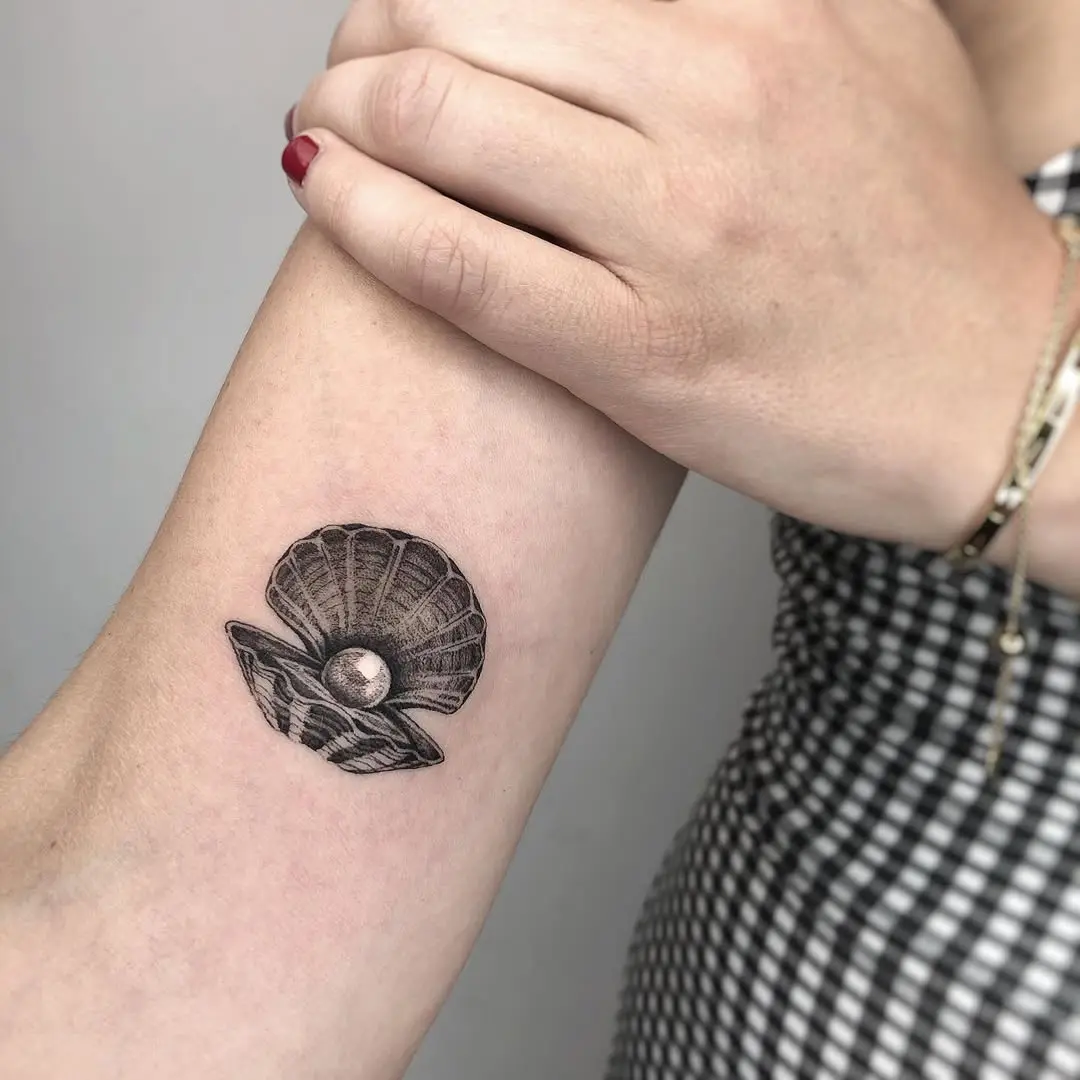 Elegant oyster tattoo with a hidden pearl