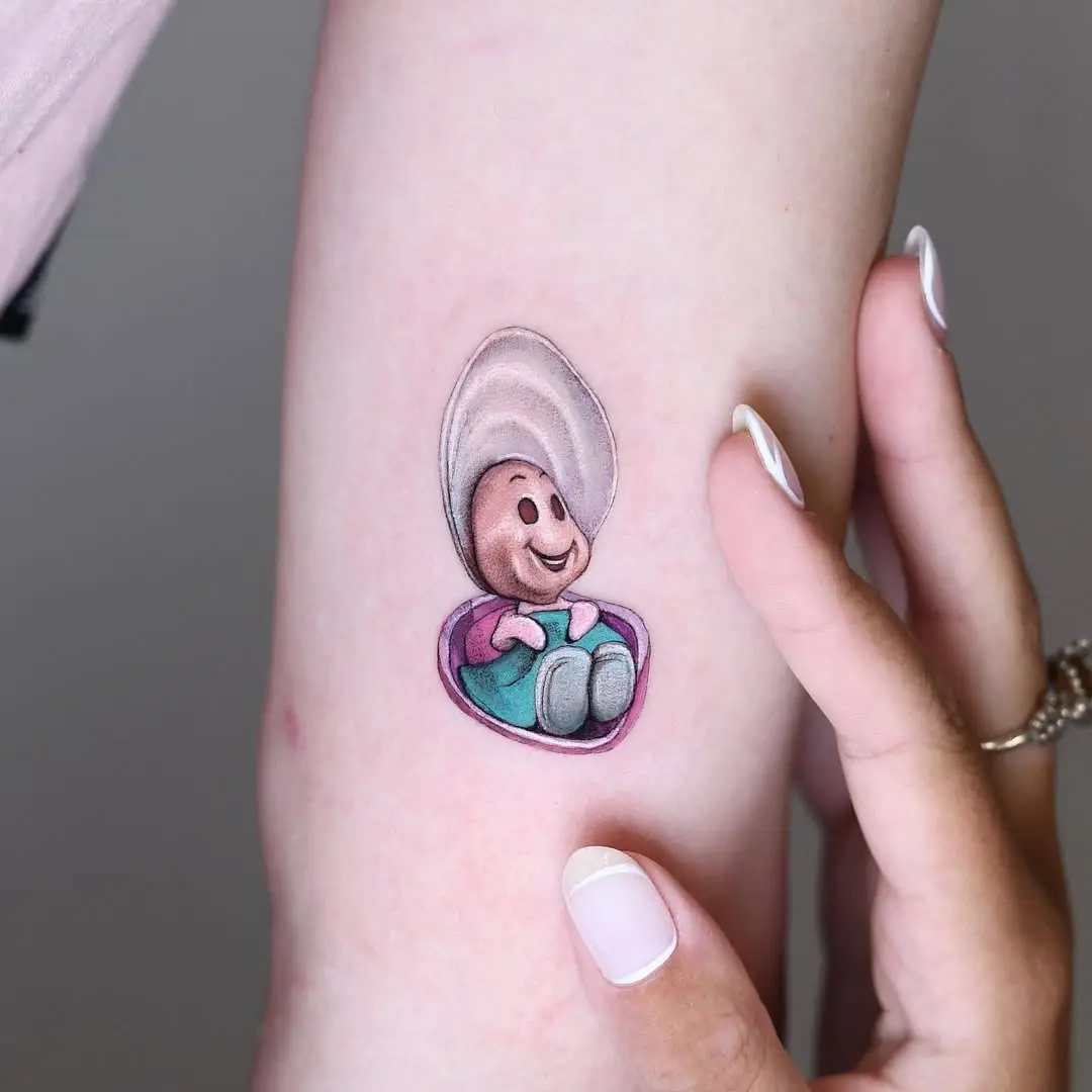Charming cartoon oyster tattoo with a joyful vibe