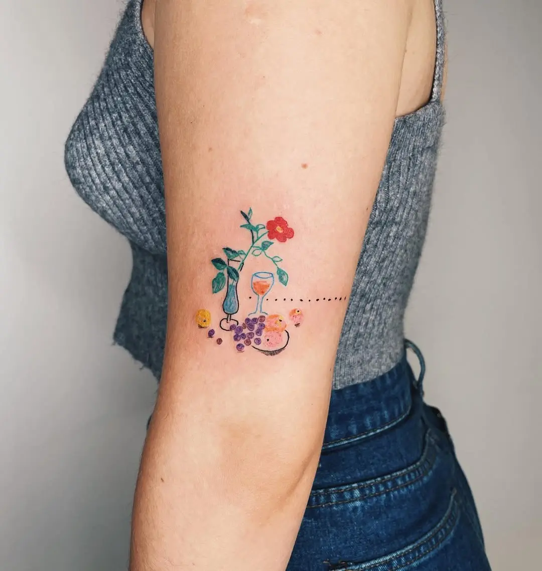 Colorful oyster tattoo with floral accents